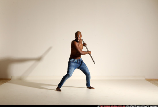 Man Adult Athletic Black Fighting with spear Moving poses Pants