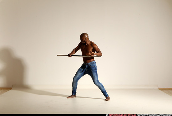 Man Adult Athletic Black Fighting with spear Moving poses Pants