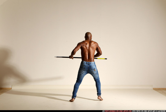 Man Adult Athletic Black Fighting with spear Moving poses Pants