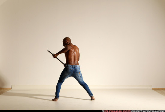 Man Adult Athletic Black Fighting with spear Moving poses Pants