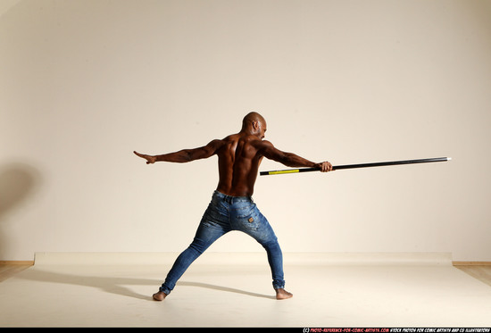 Man Adult Athletic Black Fighting with spear Moving poses Pants