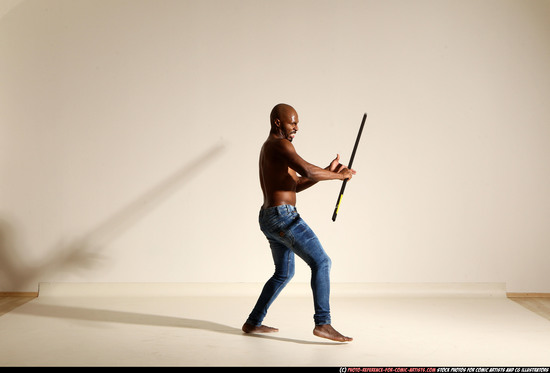 Man Adult Athletic Black Fighting with spear Moving poses Pants