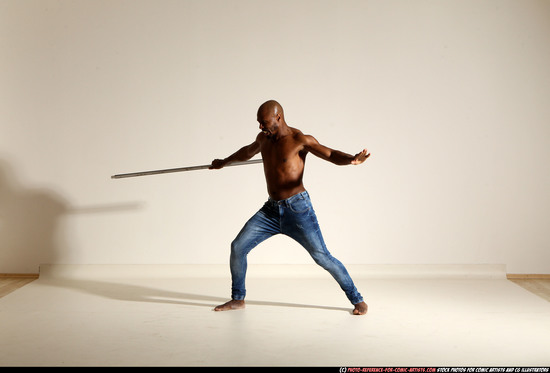 Man Adult Athletic Black Fighting with spear Moving poses Pants