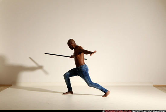 Man Adult Athletic Black Fighting with spear Moving poses Pants