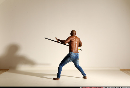 Man Adult Athletic Black Fighting with spear Moving poses Pants