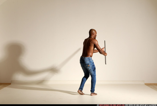 Man Adult Athletic Black Fighting with spear Moving poses Pants