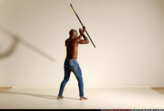 Man Adult Athletic Black Fighting with spear Moving poses Pants