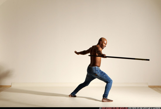 Man Adult Athletic Black Fighting with spear Moving poses Pants