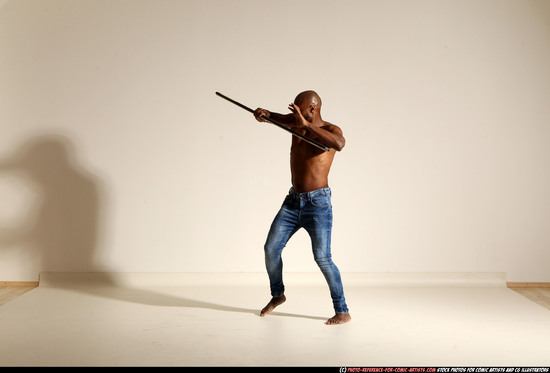 Man Adult Athletic Black Fighting with spear Moving poses Pants