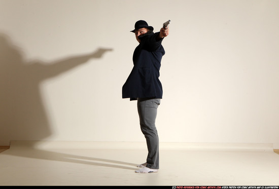 Man Adult Muscular White Fighting with gun Standing poses Coat