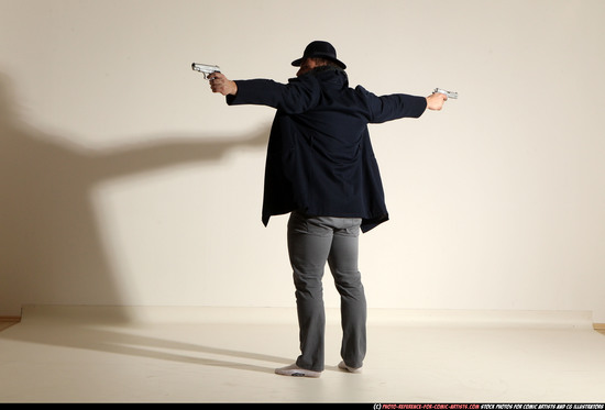 Man Adult Muscular White Fighting with gun Standing poses Coat