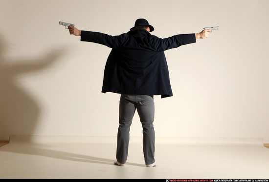 Man Adult Muscular White Fighting with gun Standing poses Coat