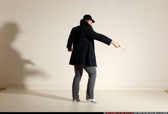 Man Adult Muscular White Fighting with gun Standing poses Coat