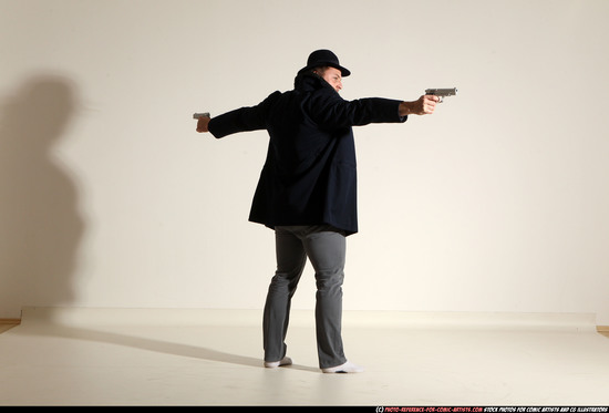 Man Adult Muscular White Fighting with gun Standing poses Coat