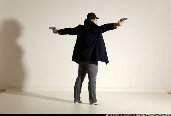 Man Adult Muscular White Fighting with gun Standing poses Coat