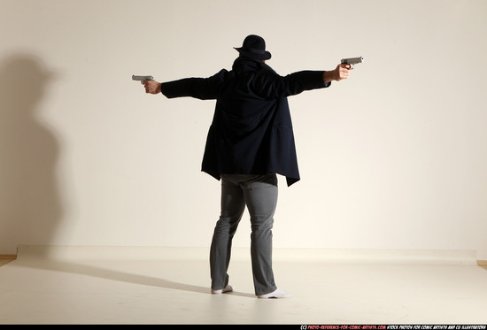 Man Adult Muscular White Fighting with gun Standing poses Coat