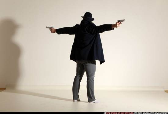 Man Adult Muscular White Fighting with gun Standing poses Coat