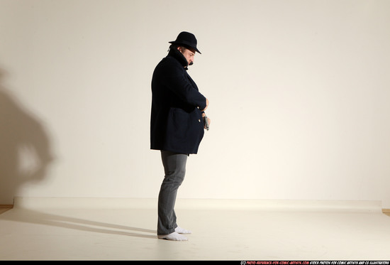 Man Adult Muscular White Fighting with gun Standing poses Coat