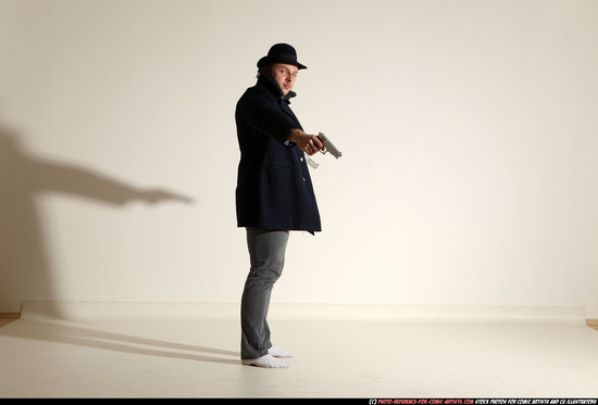 Man Adult Muscular White Fighting with gun Standing poses Coat