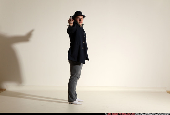 Man Adult Muscular White Fighting with gun Standing poses Coat