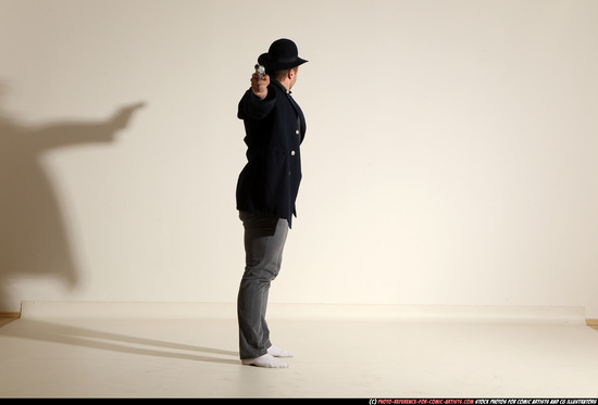 Man Adult Muscular White Fighting with gun Standing poses Coat