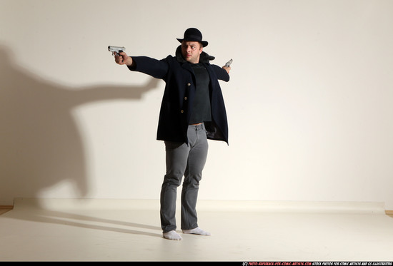 Man Adult Muscular White Fighting with gun Standing poses Coat