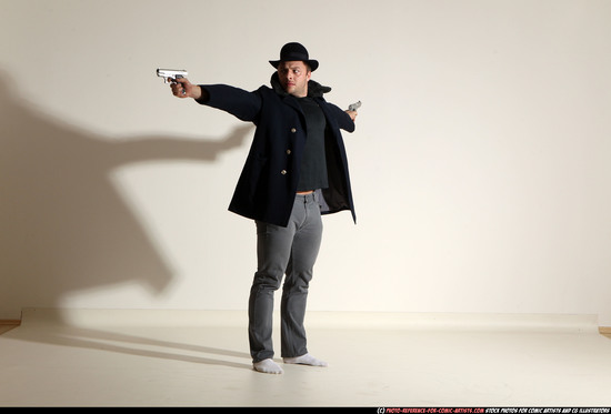 Man Adult Muscular White Fighting with gun Standing poses Coat