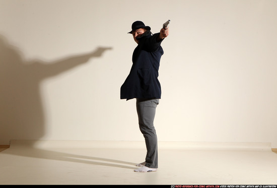 Man Adult Muscular White Fighting with gun Standing poses Coat