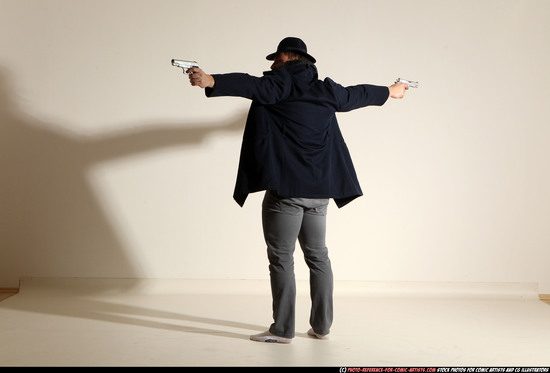 Man Adult Muscular White Fighting with gun Standing poses Coat