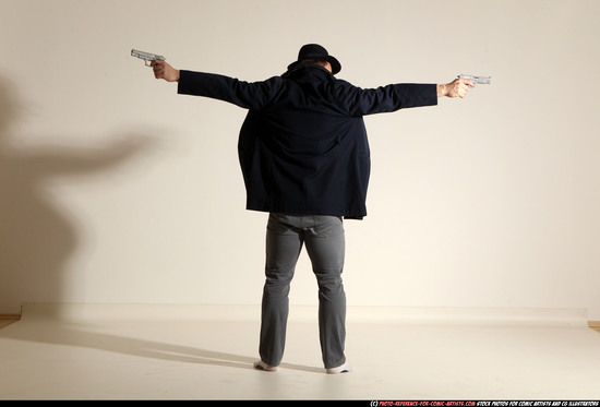 Man Adult Muscular White Fighting with gun Standing poses Coat