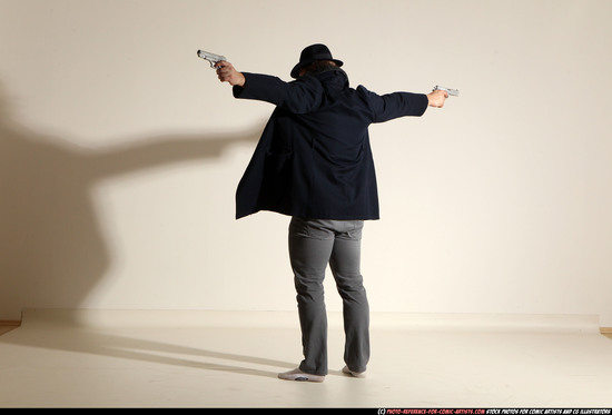 Man Adult Muscular White Fighting with gun Standing poses Coat