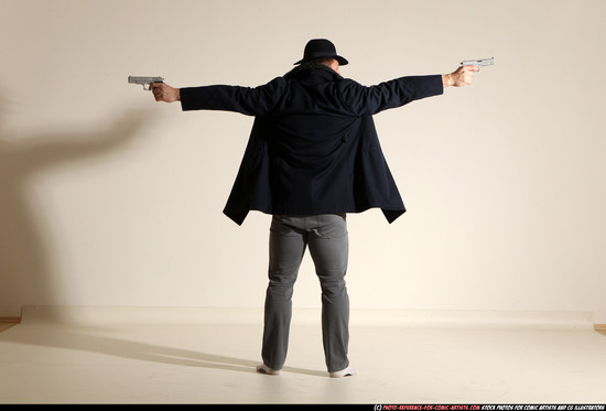 Man Adult Muscular White Fighting with gun Standing poses Coat