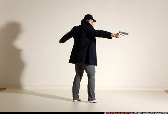 Man Adult Muscular White Fighting with gun Standing poses Coat