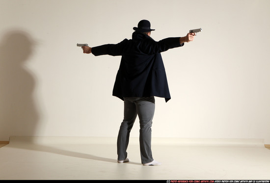 Man Adult Muscular White Fighting with gun Standing poses Coat