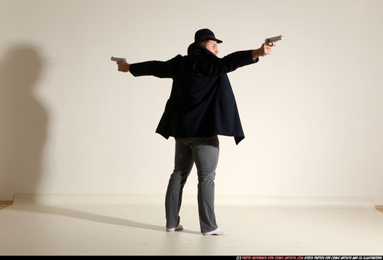 Man Adult Muscular White Fighting with gun Standing poses Coat