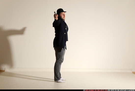 Man Adult Muscular White Fighting with gun Standing poses Coat