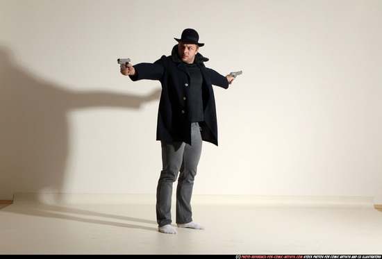 Man Adult Muscular White Fighting with gun Standing poses Coat