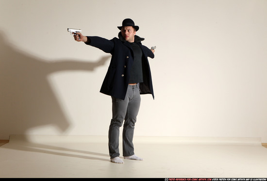 Man Adult Muscular White Fighting with gun Standing poses Coat