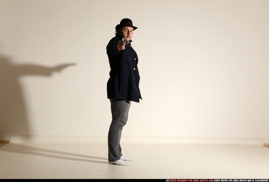 Man Adult Muscular White Fighting with gun Standing poses Coat