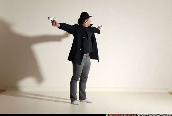 Man Adult Muscular White Fighting with gun Standing poses Coat