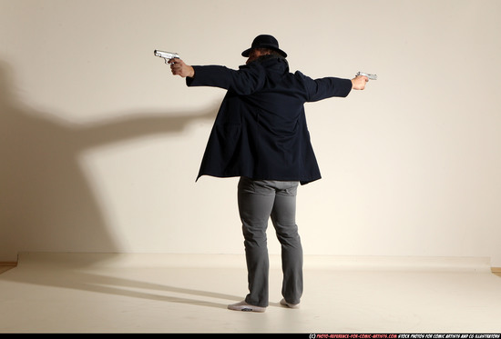 Man Adult Muscular White Fighting with gun Standing poses Coat