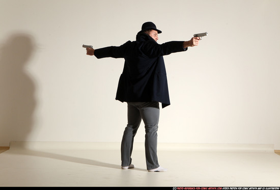 Man Adult Muscular White Fighting with gun Standing poses Coat