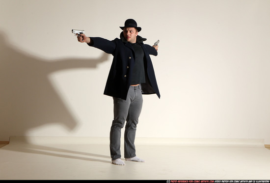 Man Adult Muscular White Fighting with gun Standing poses Coat