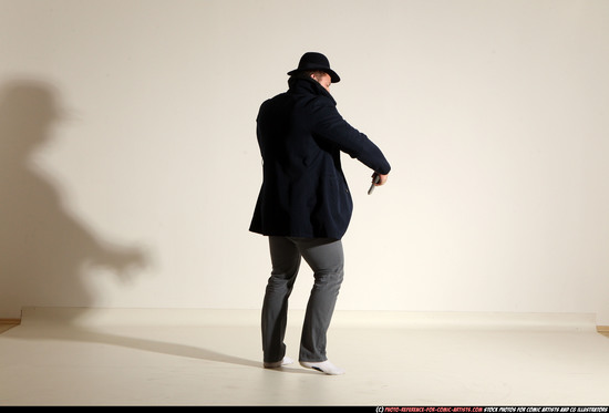 Man Adult Muscular White Fighting with gun Standing poses Coat