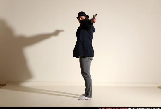 Man Adult Muscular White Fighting with gun Standing poses Coat