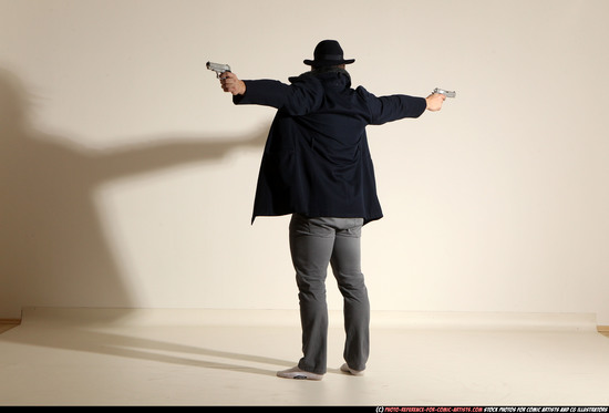 Man Adult Muscular White Fighting with gun Standing poses Coat