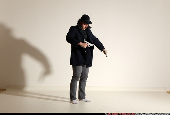 Man Adult Muscular White Fighting with gun Standing poses Coat