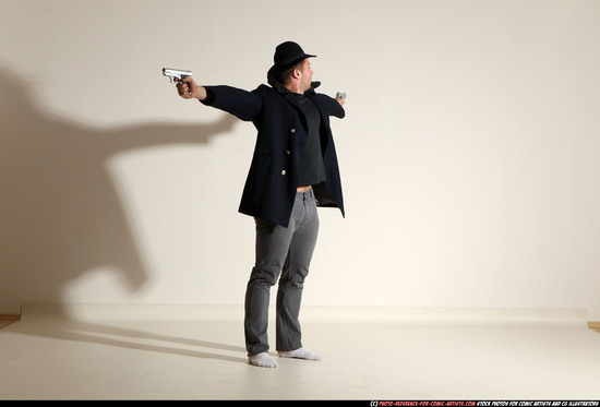 Man Adult Muscular White Fighting with gun Standing poses Coat