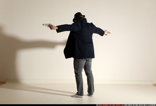 Man Adult Muscular White Fighting with gun Standing poses Coat