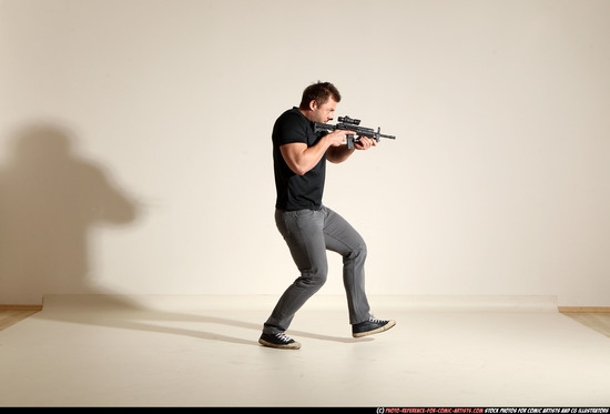 Man Adult Muscular White Fighting with submachine gun Moving poses Casual